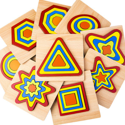 Le puzzle en bois géométrique de bloc de DIY 1cm joue le bébé denteux
