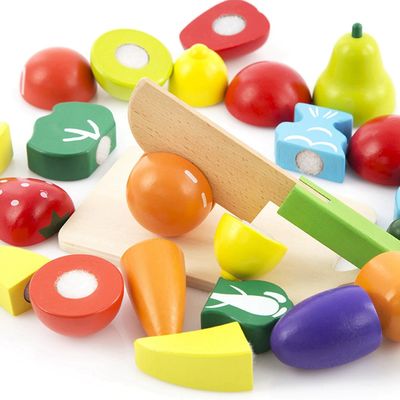Le légume en bois coloré de la simulation ISO9001 joue le fruit en bois de jeu