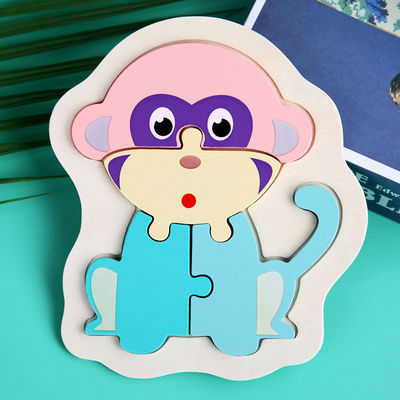 Le puzzle en bois de bloc de Macaron 3D joue les blocs animaux en bois
