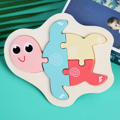 Le puzzle en bois de bloc de Macaron 3D joue les blocs animaux en bois