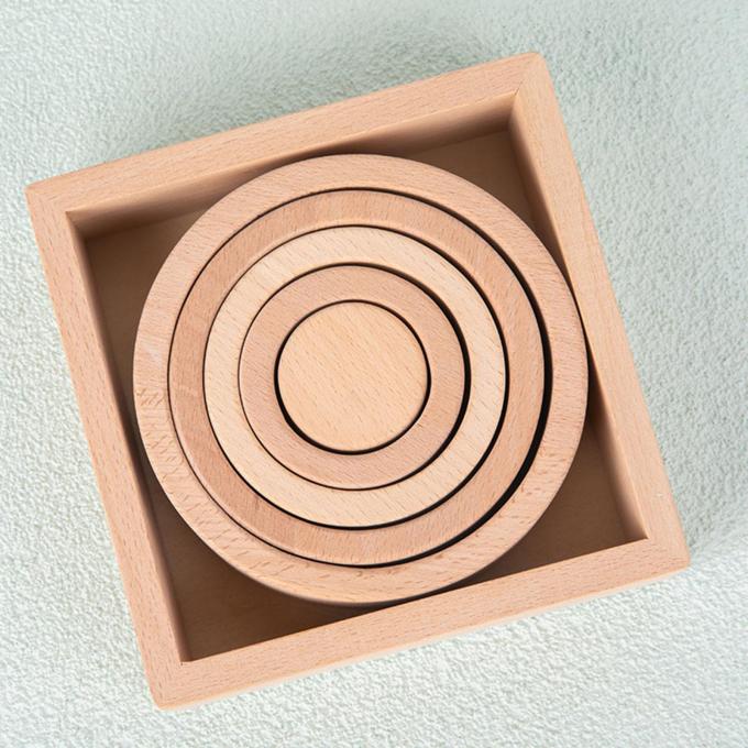 Le puzzle en bois d'emboîtement d'empileur bloque Montessori empilant le jeu pour les filles préscolaires de garçons